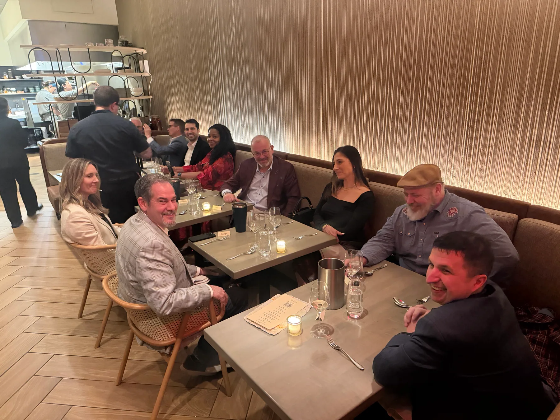 Guests gathered around tables at a private dining event