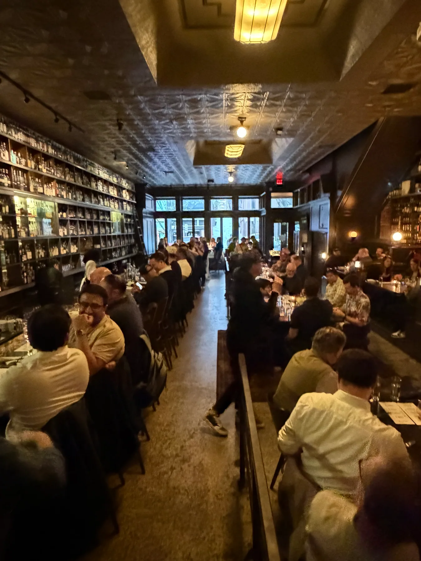 A full restaurant welcoming guests for a private event