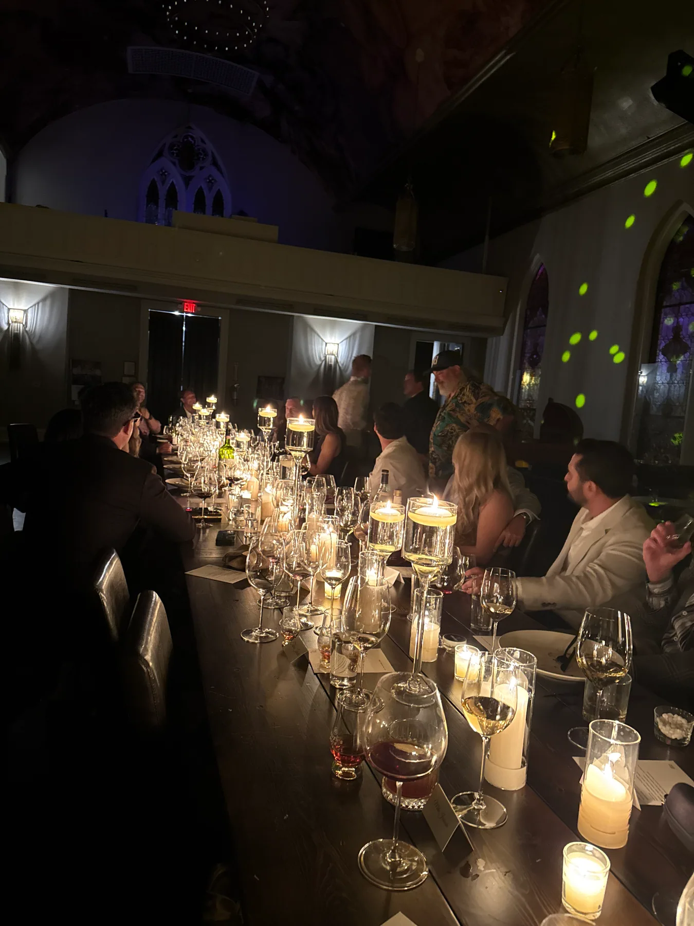 Guests enjoying a candlelit multi-course dinner
