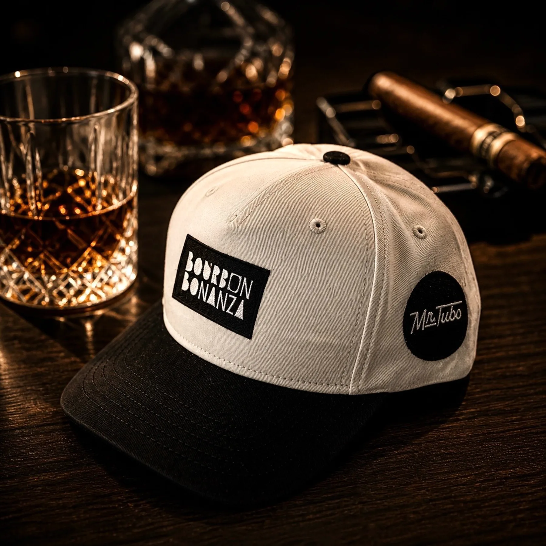 Custom Bourbon Bonanza cap staged with whiskey and a cigar